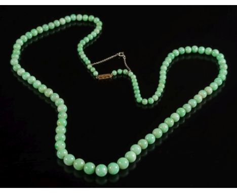 A graduated green jade bead single-string necklace: with spherical mottled green beads graduated from 4.5mm diameter to 10mm 