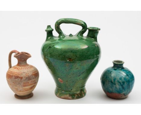 A Roman pottery ewer, a Spanish botiga and a small jar: the first decorated with iron-red concentric bands, 16 cm; the second