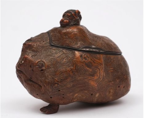 A 19th century Japanese carved root wood box and cover in the form of a grotesque beast: the hinged lid with bear's head fini