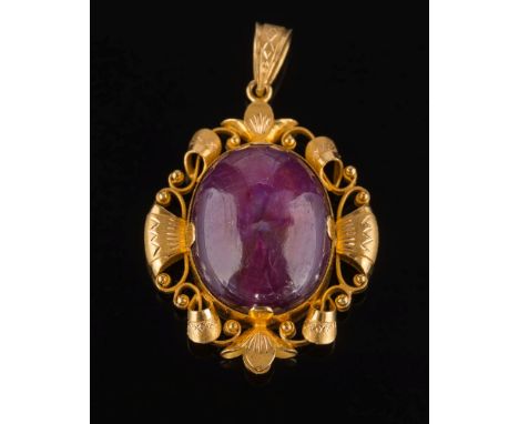 An oval cabochon ruby single-stone pendant: within scroll pierced design frame, approximately 37mm total length of pendant, 1