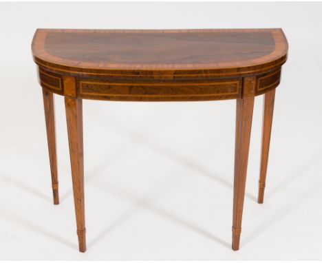 An early 19th Century rosewood, satinwood crossbanded and inlaid card table:, of D shaped outline, bordered with boxwood and 