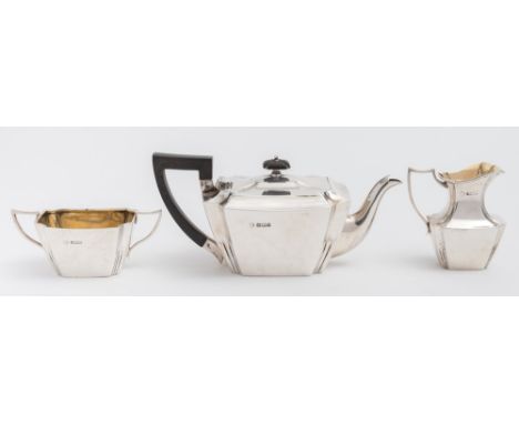 An Edward VII batchelor's silver three-piece tea service, maker William Hutton & Sons, Sheffield, 1909: of rectangular taperi