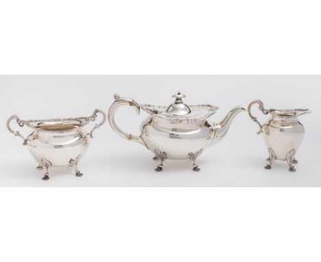 An Edward VII  Scottish silver three-piece tea service, maker John Alexander Fettes, Glasgow, 1907: of oval form, with foliat