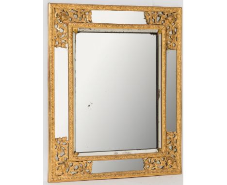 A 19th century carved giltwood and gesso rectangular marginal wall mirror:, the central plate with a bevelled slip and moulde