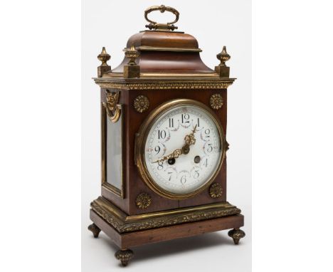 A French mahogany mantel clock: the eight-day duration movement striking the hours and half-hours on a gong, the backplate st