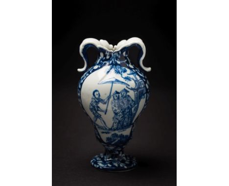 A rare Vauxhall blue and white vase: of ogee form with foliate scrolled handles, painted with panels depicting an extensive o