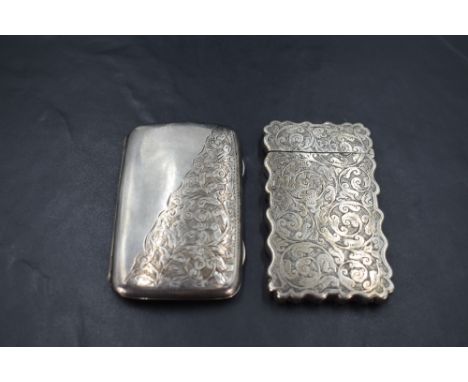 An Edwardian silver cigarette case, of rectangular form with sprung hinge and half engraved foliate scroll decoration, the gi