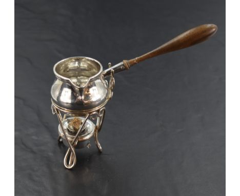 A Victorian silver toddy ladle and warming stand, the baluster ladle body with angular spout, moulded rim and turned wooden h