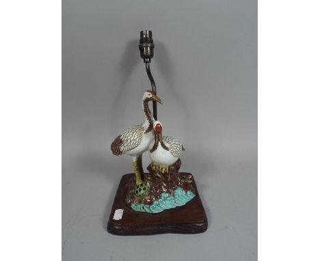An Oriental Figural Table Lamp in The Form of Pair of Birds with Tortoise (AF).