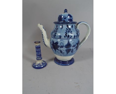 A Large Blue Glazed Coffee Pot and Blue and White Candle Stick.