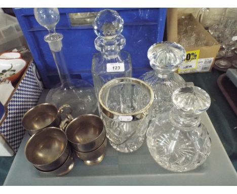 A Tray Containing Four Glass Decanters, Glass Ice Bucket, Silver Plated Cups.