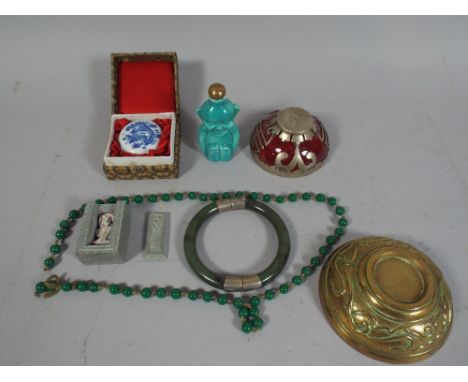 A Collection of Oriental Items to Include Silver Mounted Bowl, Jade Bracelet, Figural Opium Bottle, Beads Etc. 
