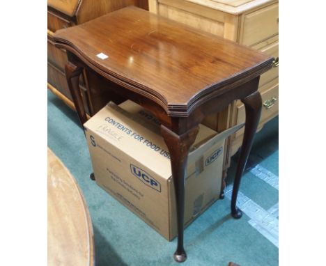 A mahogany fold over card table Condition Report: Available upon request