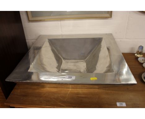 A large pewter planter