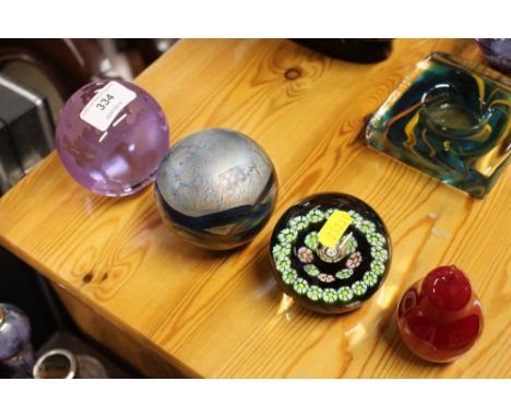 Four various glass paper weights to include Isle of White and Caithness