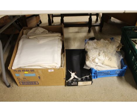 Two boxes containing lace and textiles; and a box containing a child's lace gown