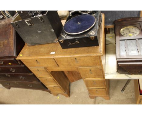 A light oak kneehole writing desk for restoration