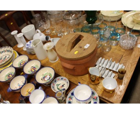 A pair of white ceramic toast racks; a stone ware jelly mould; a terracotta pot with lid; a pair of white glazed candle stick