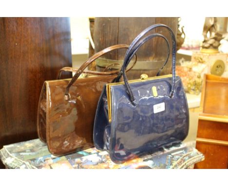 A Holmes of Norwich pair of vintage patterned suede lined handbags in copper and blue with original labels 