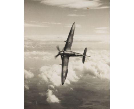 A SPITFIRE IN FLIGHT C. 1940s SOLD TOGETHER WITH A LARGE FORMAT SILVER PRINT PORTRAIT OF AN ARAB MAN C. 1960 the first 37 cm 