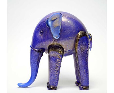 Attributed to Napoleone Martinuzzi, Venini. A blue glass and gold leaf applied elephant with tall legs and long sweeping trun