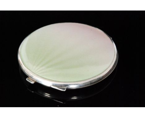 A mid 20th Century hallmarked silver circular compact the hinged cover decorated with graduated pink to green enamel, diamete