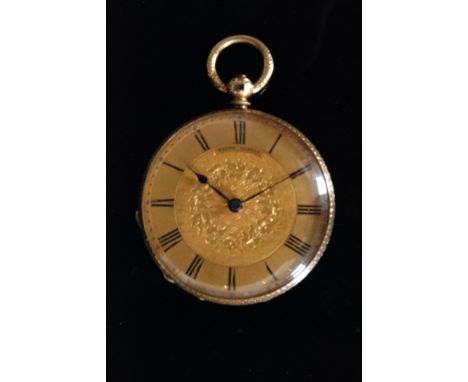 A Swiss 18ct open faced key wind pocket watch of circular outline with Roman numerals to gilt and foliate engraved dial, dial