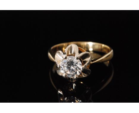 An 18ct diamond solitaire, brilliant cut stone, weight approximately 0.80ct, colour, I/J, clarity VS2, high claw set to a flo