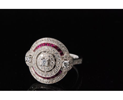 A modern silver Art Deco style synthetic ruby and cubic zirconia target cluster ring, ring size O. 