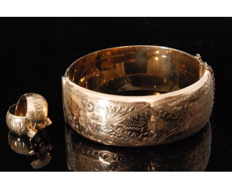 A hallmarked 9ct hinged bangle with all over foliate engraved decoration, weight 32g, Chester 1962, together with a pair of y