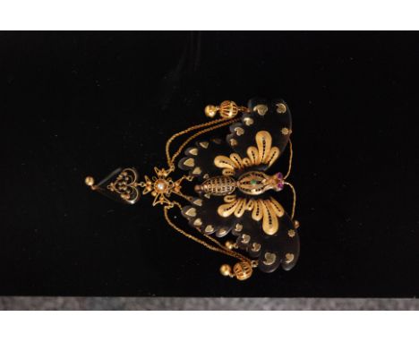 A 19th Century gold mounted tortoiseshell butterfly clip with outstretched wings, applied gold filligree work decoration to t