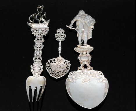 A Continental silver ornate spoon the terminal modelled as Augustus II, length 27cm, together with a similar fork with a term