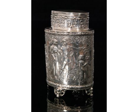 An early 20th Century German silver tea caddy of ovoid form, embossed with figural fete galante decoration within a floral bo