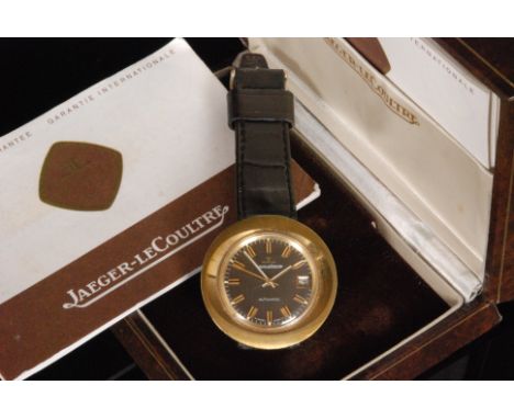 A 1970s gentleman's Jaeger-LeCoultre automatic wrist watch with gilt batons and date facility to a tan circular dial within m