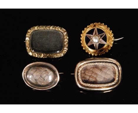 Three Georgian yellow metal memorial brooches each with central plaited hair panel within raised borders, together with a sim