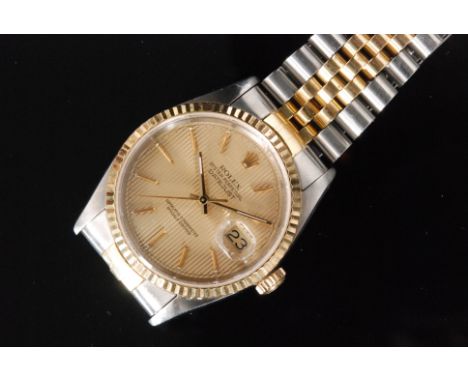 A Rolex Oyster Perpetual Datejust gentleman's automatic wristwatch, gilt engine turned dial with gilt baton hands and magnifi