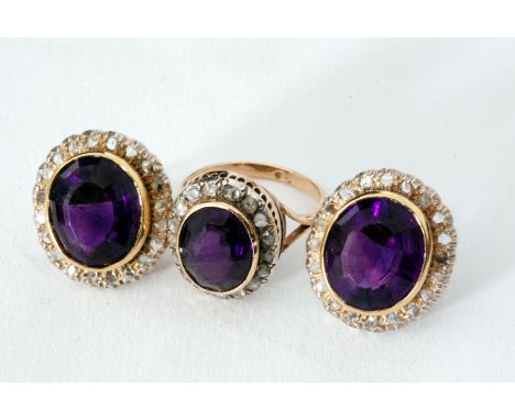 A pair of 18ct amethyst and diamond earrings, central oval collar set amethyst, weight approximately 6.60ct within old cut di