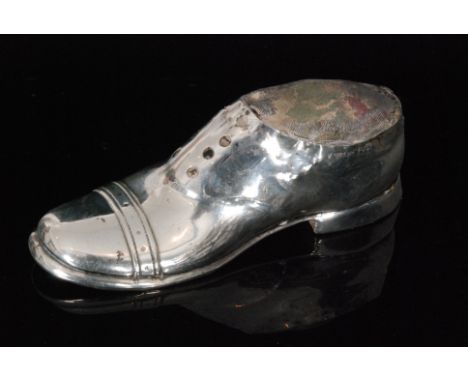 An Edwardian hallmarked silver pin cushion of plain form modelled as a gentleman's shoe with wooden base, length 13cm, Cheste