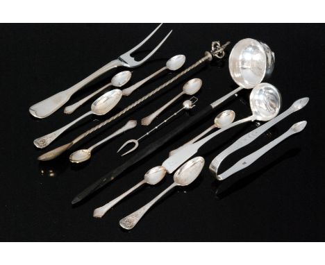 A small parcel lot of assorted flatware to include a toddy ladle, a Georgian twin tined fork, sauce ladle, teaspoons etc. 