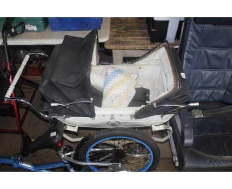 A vintage silver cross pram