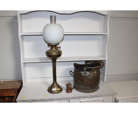 A brass Corinthian columned oil lamp; a coal scuttle and a small copper and brass teapot
