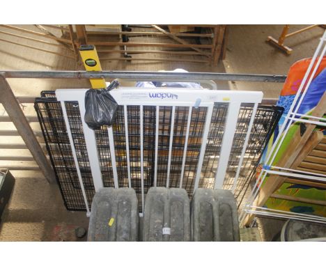 A folding fire guard and a stair gate 