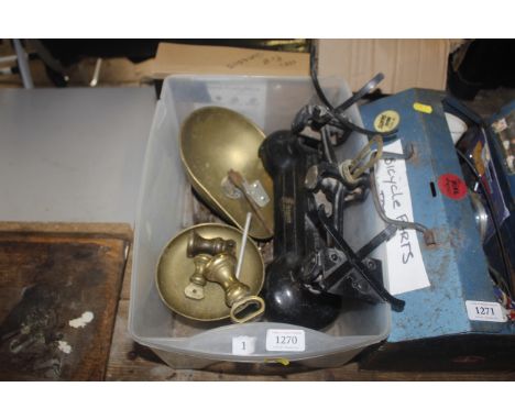 A box containing scales, weights and drill bits