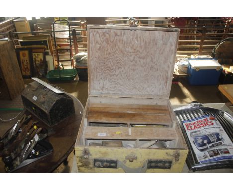 A wooden tool box and contents including chisels 