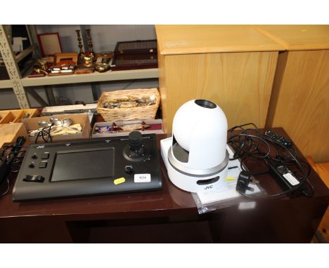 A JVC remote camera KY-PZ100 together with a JVC remote camera controller RM-LP100 and instruction manual