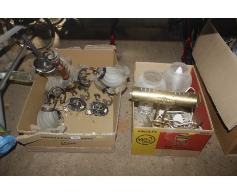 Two boxes containing light fittings and lamps 