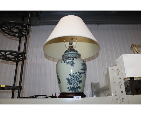 A blue and white table lamp and shade 