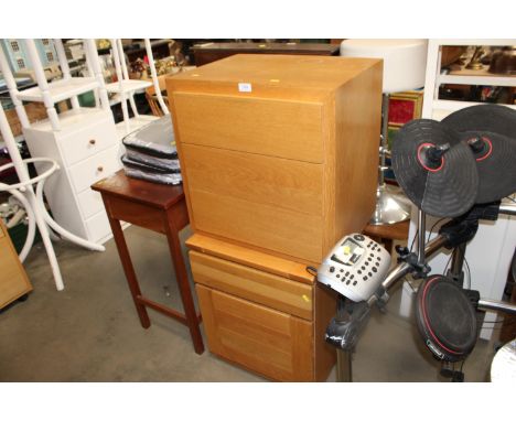 A modern light oak bedside chest fitted three drawers together with a modern oak filing cabinet fitted two drawers