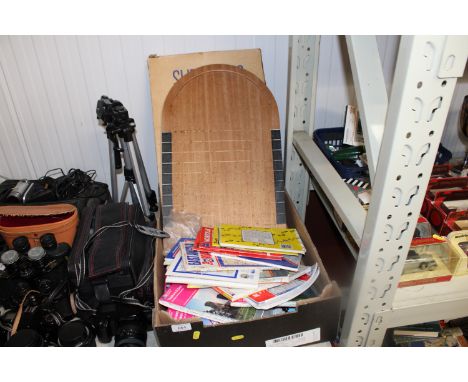 A box containing a shove ha'penny board and Ordnance Survey maps 