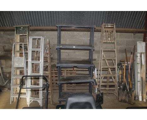 A plastic five tier shelf rack